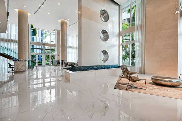 a living room with a window and gym equipment