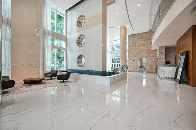 a view of a living room with a large window