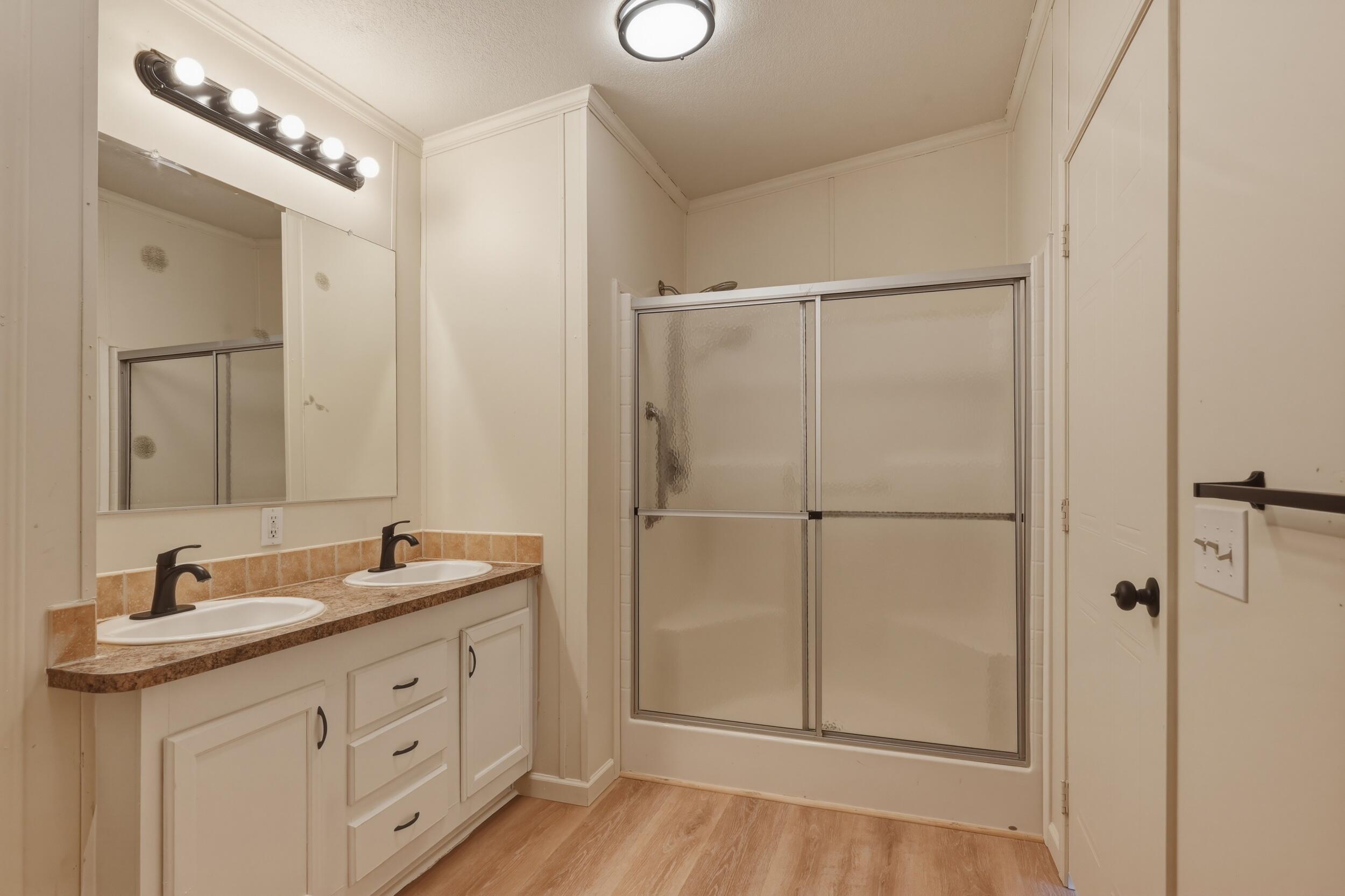312 East Cedar Milll Road Star Valley, AZ 85541 - Photo 23 of 27 a bathroom with a double vanity sink and mirror