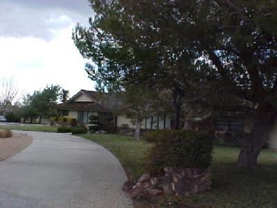 19530 Tonkawan Road Apple Valley, CA 92307 - Photo 1 of 1 a view of a street with a building in the background