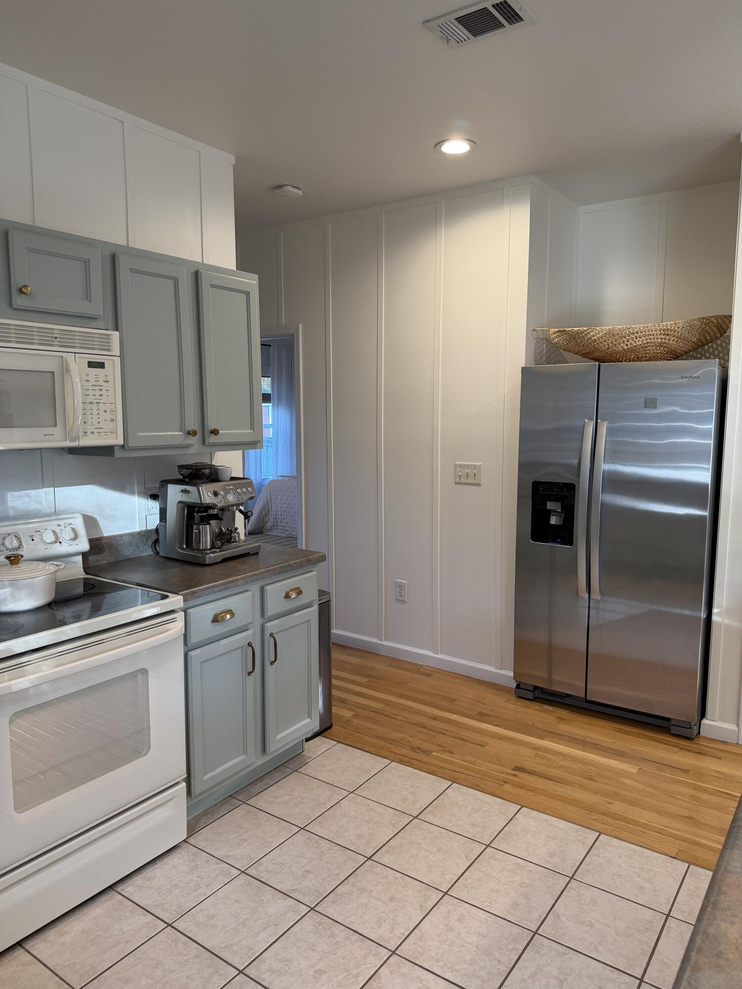 176 Georgie Street Santa Rosa Beach, FL 32459 - Photo 14 of 31 a kitchen with stainless steel appliances granite countertop a refrigerator and a stove top oven