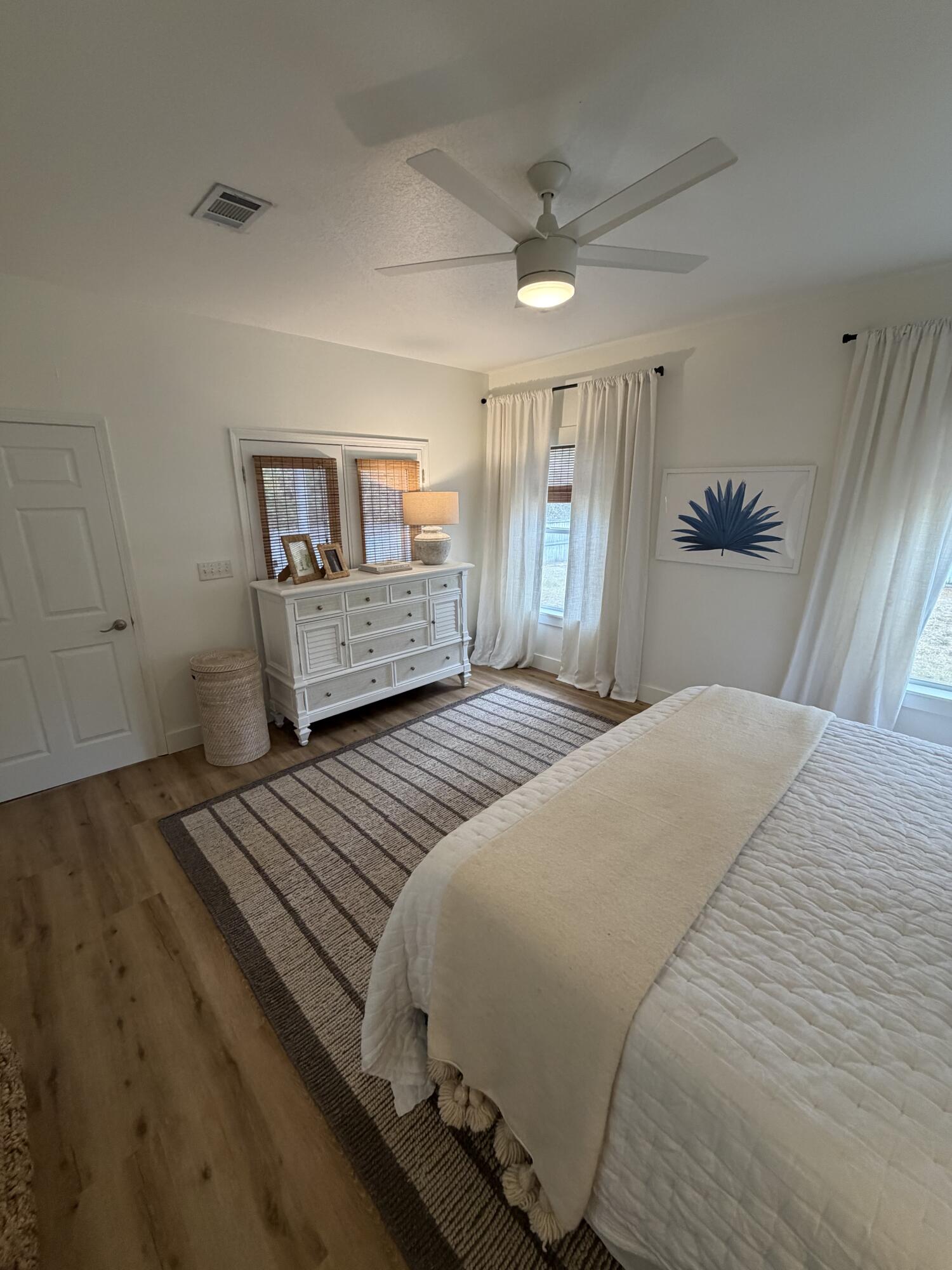 176 Georgie Street Santa Rosa Beach, FL 32459 - Photo 18 of 31 a bedroom with a bed and a dresser