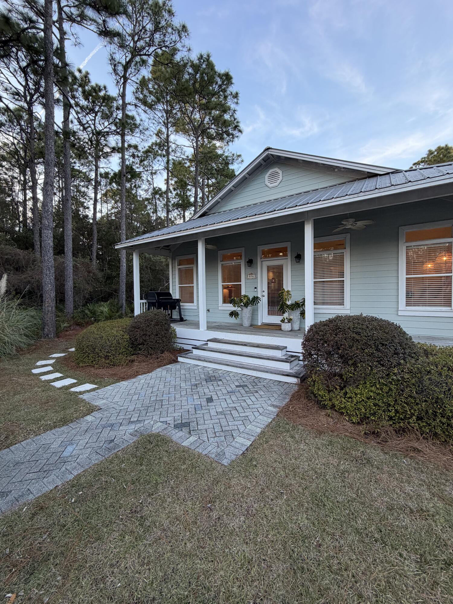 176 Georgie Street Santa Rosa Beach, FL 32459 - Photo 2 of 31 a front view of a house with garden