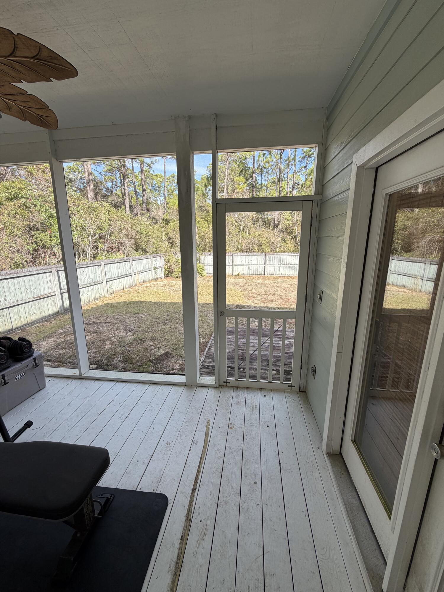 176 Georgie Street Santa Rosa Beach, FL 32459 - Photo 28 of 31 a view of an empty room with wooden floor and a window