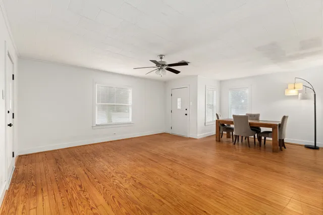 a view of dining room with furniture and window