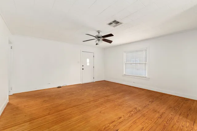 a view of an empty room with a window