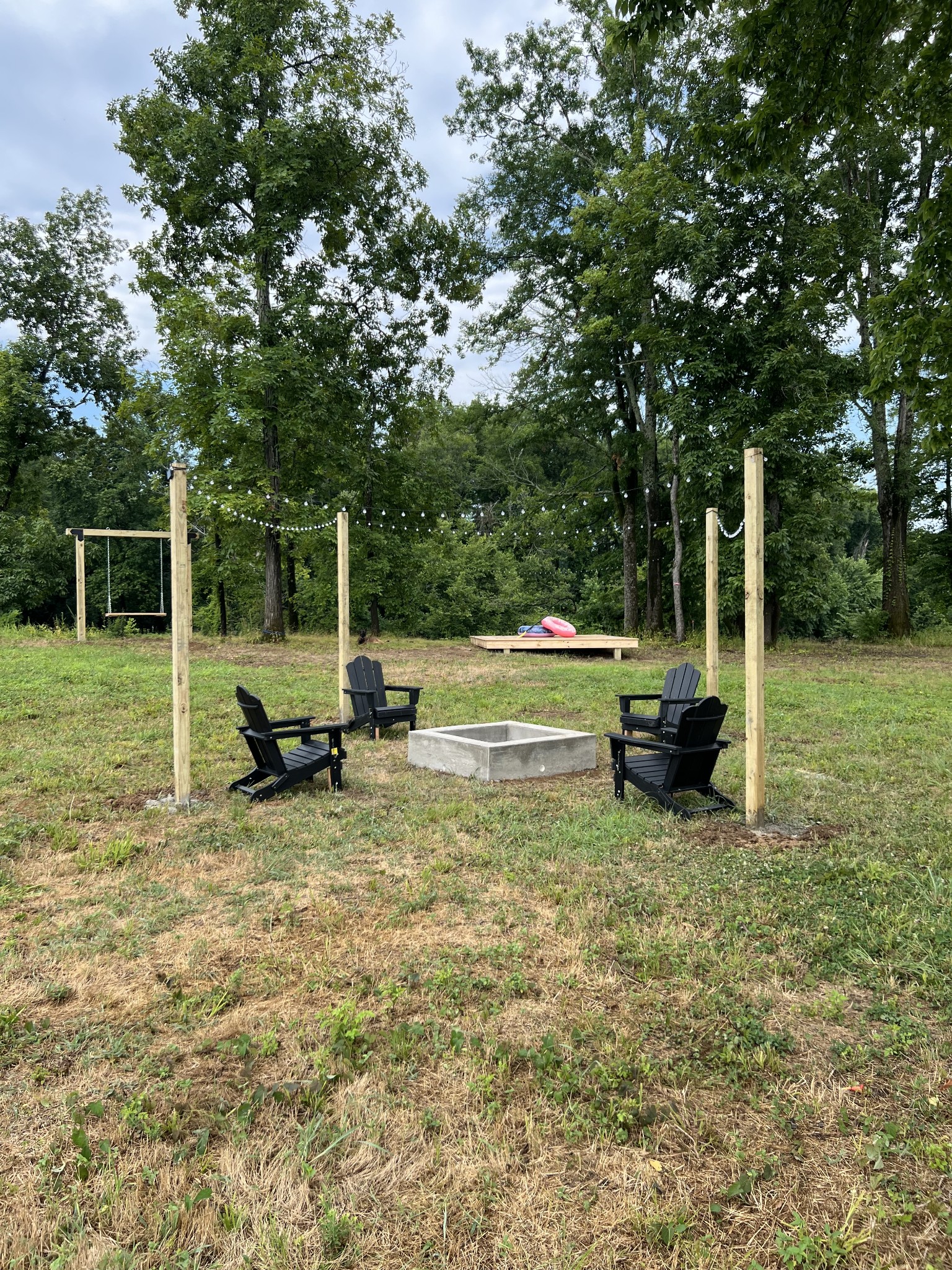 6725 Cravens Road Savannah, TN 38372 - Photo 2 of 11 a view of a park with swings and a tree