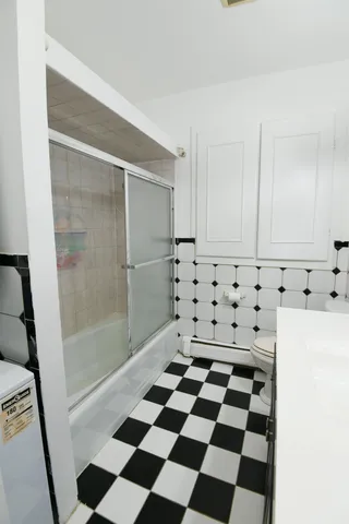 a black and white checkered floor with a black white checkered floor
