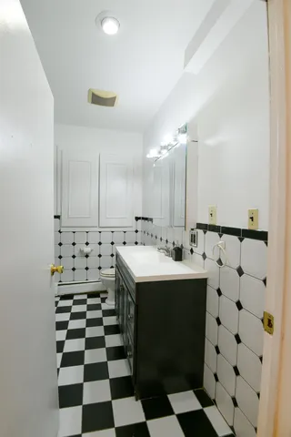 a kitchen with a stove a sink and a refrigerator