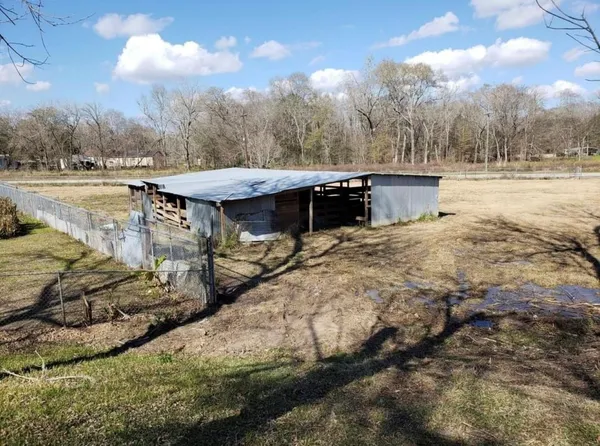 a view of a lake in between two chairs