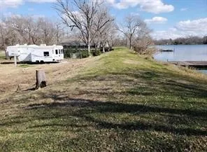 a view of lake with green space