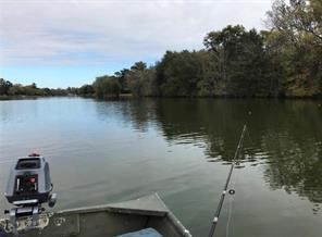 111 County Road 1333 Liberty, TX 77575 - Photo 18 of 32 a view of a lake in between two chairs