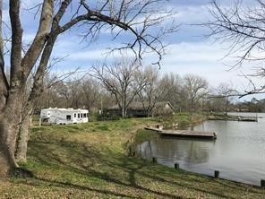 111 County Road 1333 Liberty, TX 77575 - Photo 2 of 32 a view of a yard with large trees