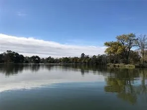 a view of lake with green space