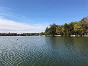 a view of lake with green space