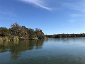 111 County Road 1333 Liberty, TX 77575 - Photo 30 of 32 a view of lake with mountain