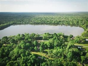 111 County Road 1333 Liberty, TX 77575 - Photo 7 of 32 an aerial view of valley and lake