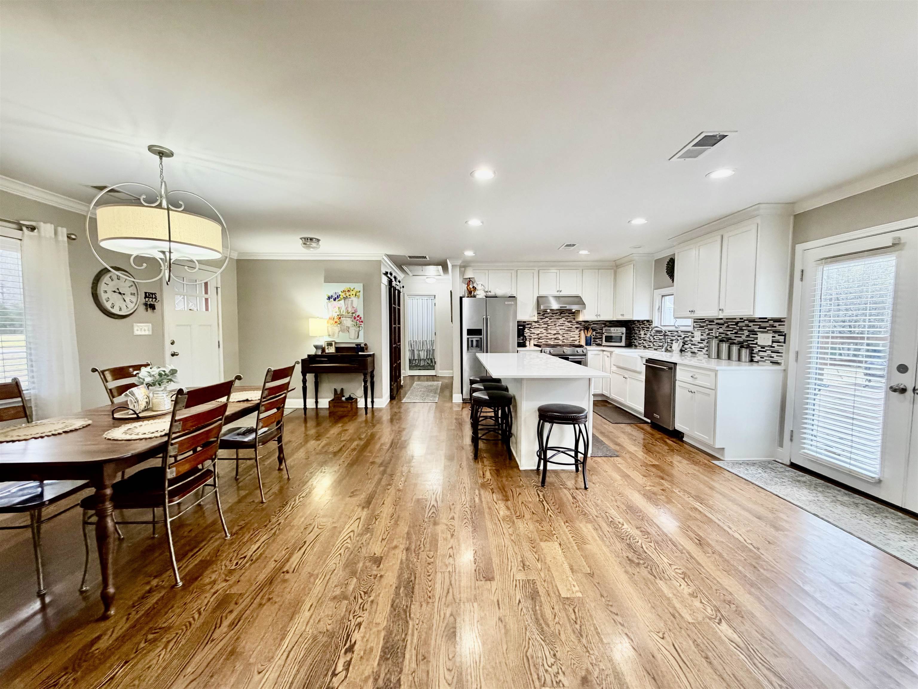 6195 Bobbitt Road Moscow, TN 38057 - Photo 8 of 40 a living room with stainless steel appliances kitchen island granite countertop furniture wooden floor and a view of kitchen