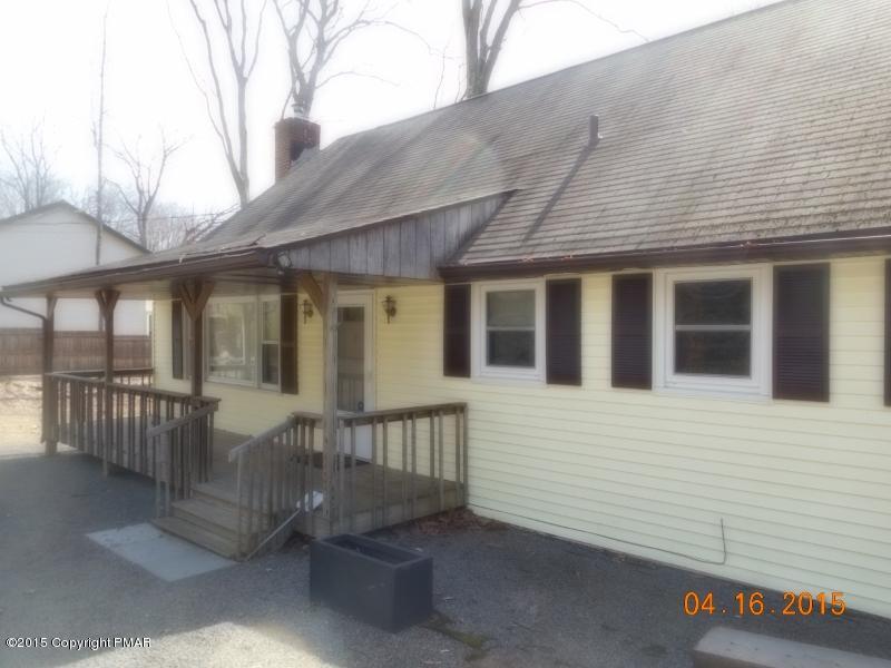 413 Devils Hole Road Cresco, PA 18326 - Photo 1 of 15 a view of a house with backyard and porch