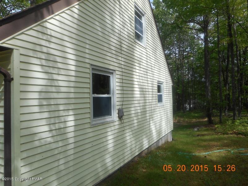 413 Devils Hole Road Cresco, PA 18326 - Photo 13 of 15 a view of a house with a yard