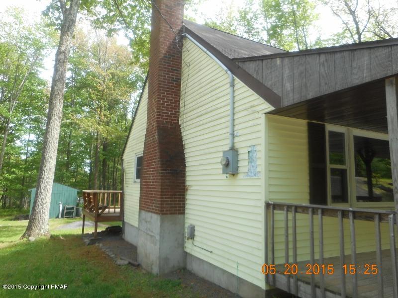 413 Devils Hole Road Cresco, PA 18326 - Photo 15 of 15 a side view of a house with backyard