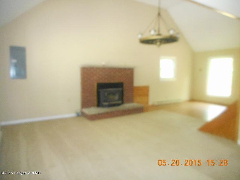 413 Devils Hole Road Cresco, PA 18326 - Photo 2 of 15 a view of empty room with a fireplace