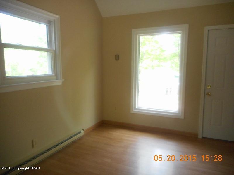 413 Devils Hole Road Cresco, PA 18326 - Photo 4 of 15 a view of an empty room and a window