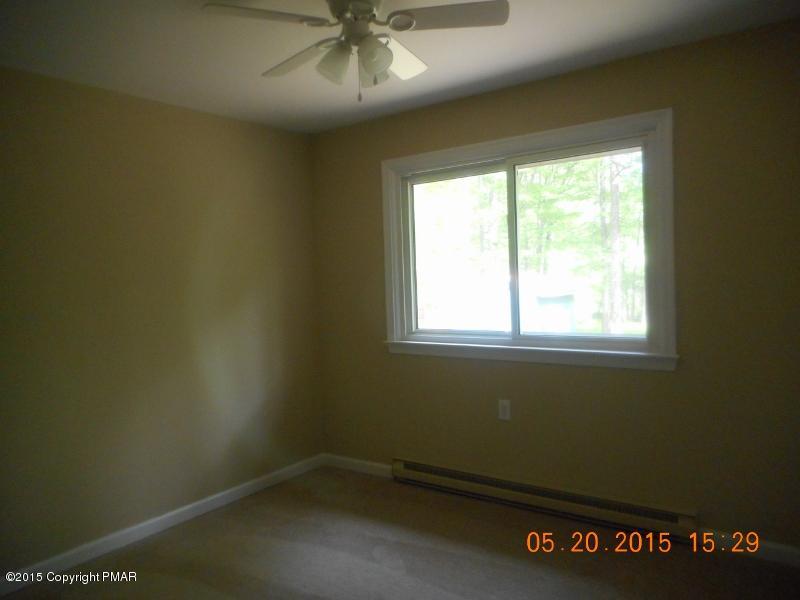 413 Devils Hole Road Cresco, PA 18326 - Photo 7 of 15 an empty room with a window