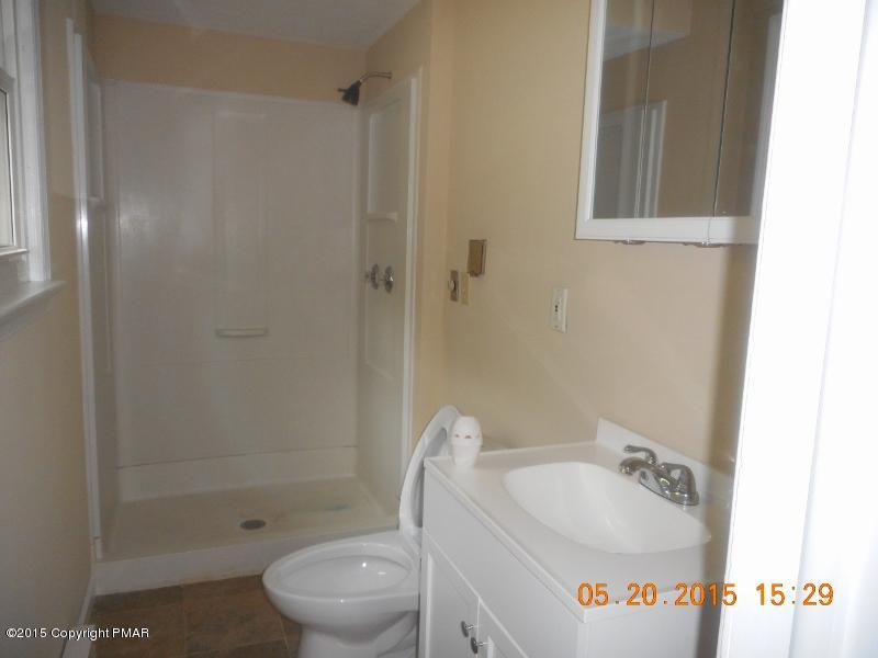 413 Devils Hole Road Cresco, PA 18326 - Photo 8 of 15 a bathroom with a sink toilet and shower