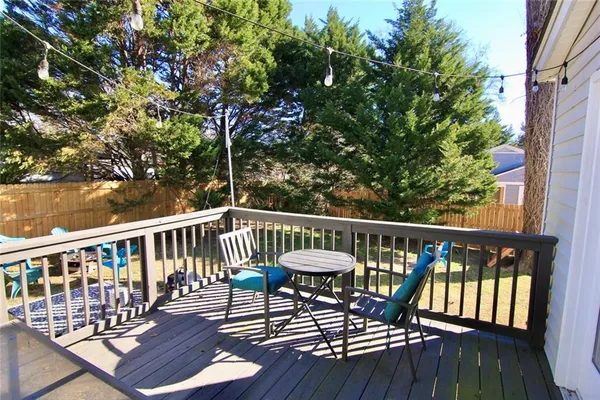 a view of a balcony with furniture
