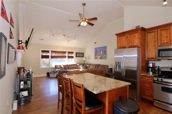 a view of a dining room with furniture and wooden floor