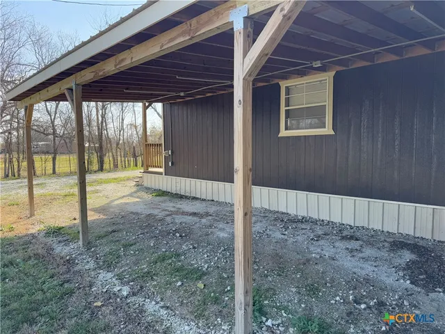 a view of an empty room with sliding window