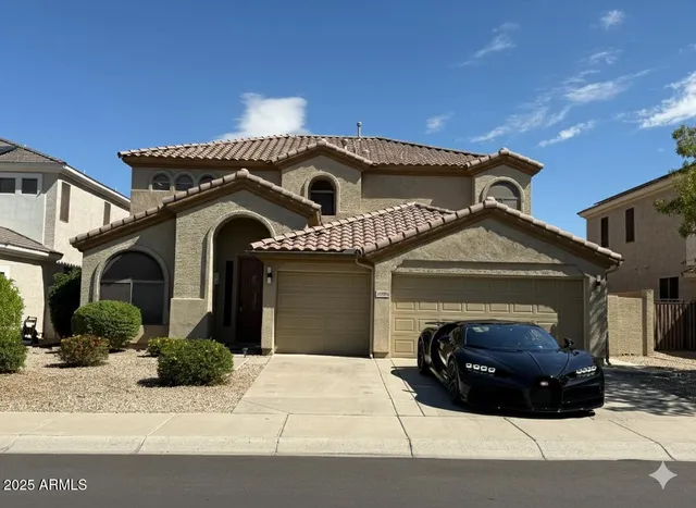 a front view of a house with a garage