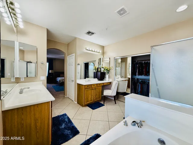 a bedroom with a bed and a television