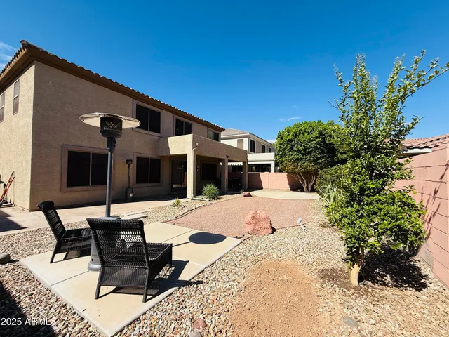 a house with trees in the background