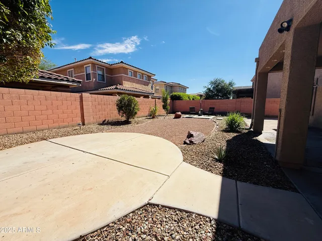 an aerial view of multiple houses with yard