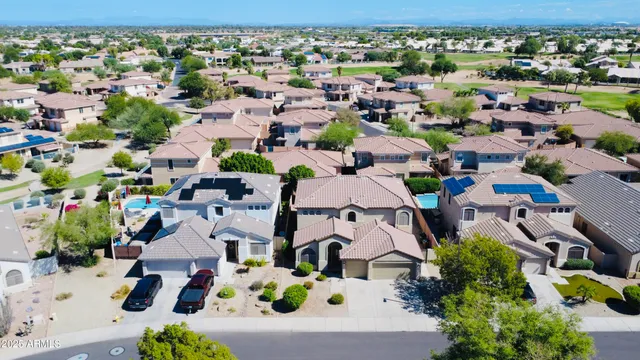an aerial view of a house with a garden