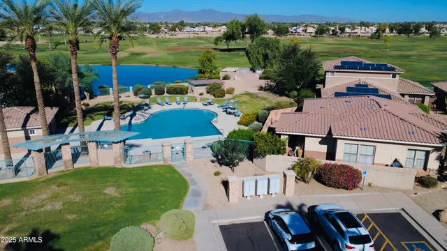 an aerial view of residential houses with outdoor space