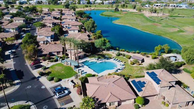 an aerial view of a house with outdoor space swimming pool outdoor seating and yard
