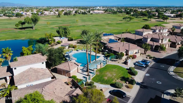 an aerial view of a tennis ground with lots of residential buildings