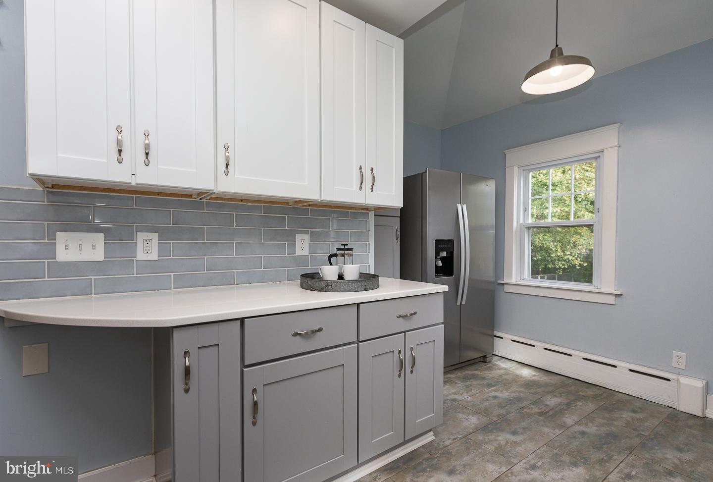 2029 Laurel Road Havertown, PA 19083 - Photo 14 of 45 a kitchen with stainless steel appliances granite countertop a sink a refrigerator and white cabinets