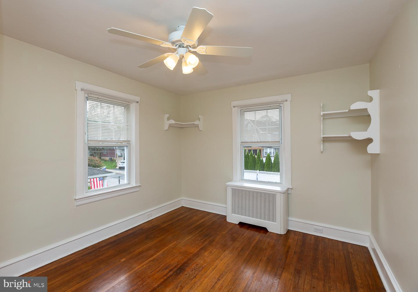 2029 Laurel Road Havertown, PA 19083 - Photo 29 of 45 a view of an empty room with wooden floor and a window