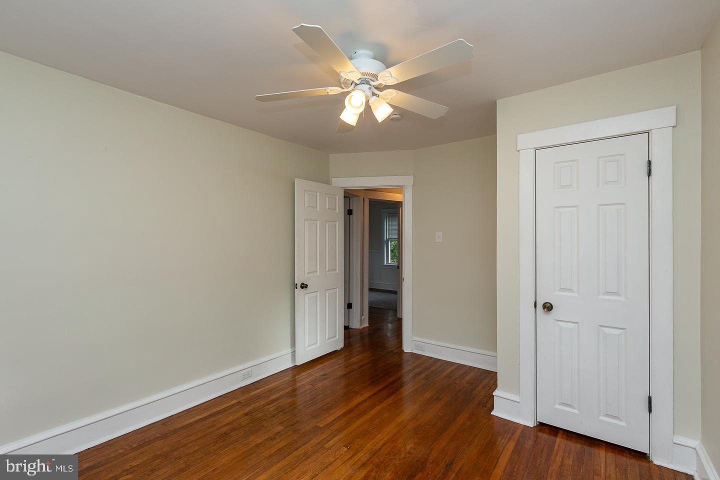 2029 Laurel Road Havertown, PA 19083 - Photo 30 of 45 a view of an empty room with wooden floor and a ceiling fan
