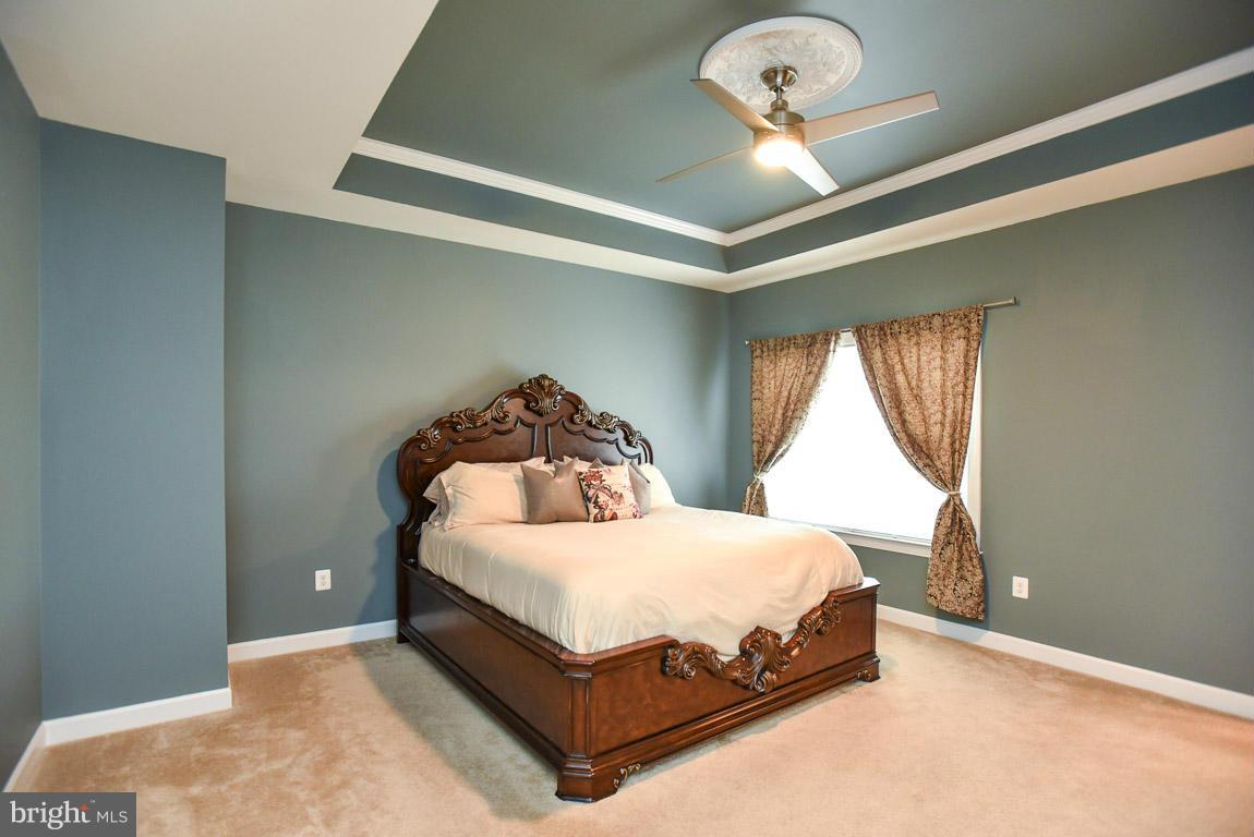25175 Prairie Fire Square Aldie, VA 20105 - Photo 14 of 28 a bedroom with a bed and window