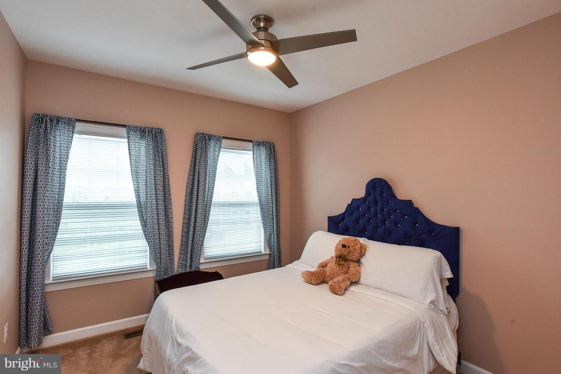 25175 Prairie Fire Square Aldie, VA 20105 - Photo 20 of 28 a bedroom with a bed and window