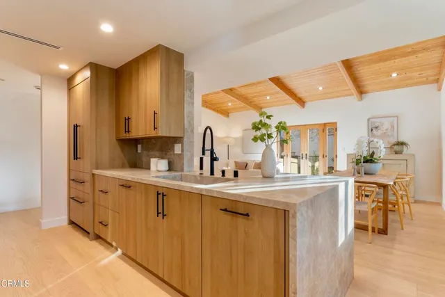 a kitchen with stainless steel appliances granite countertop a sink and cabinets