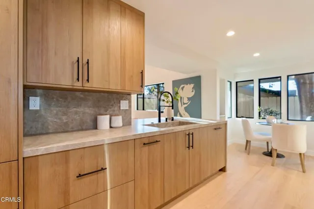 a kitchen with a sink and cabinets