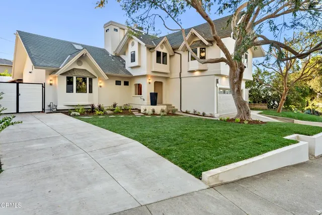 a front view of a house with a yard