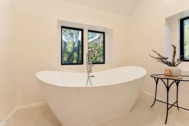 a white bath tub sitting in a bathroom