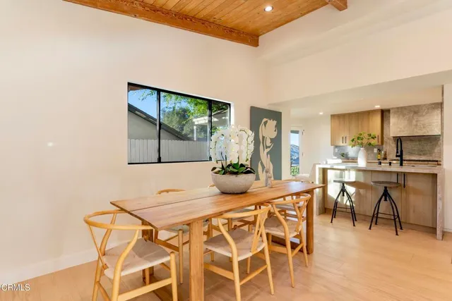 a view of a dining room with furniture window and outside view